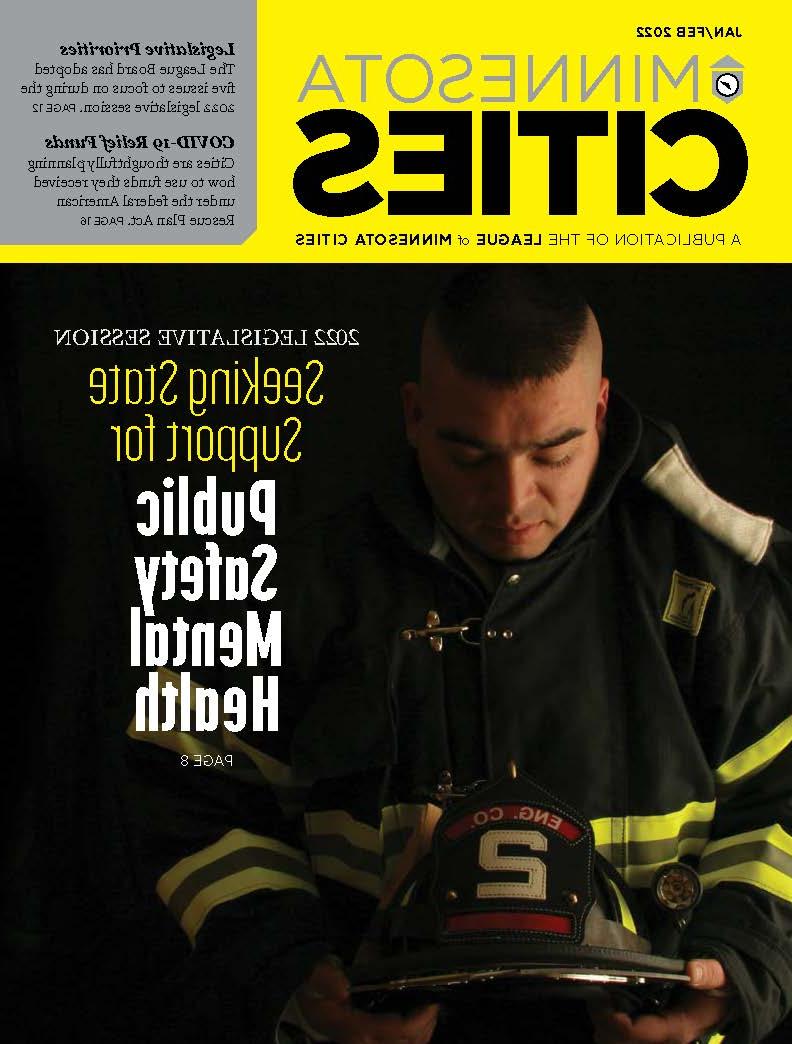 MN Cities magazine cover featuring a firefighter that looks depressed.